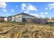 The side of the home has a low profile and minimal landscaping, with a fence at 2243 E Werges Ave, Indianapolis, IN 46237