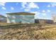 The side of the house has a low profile and minimal landscaping at 2243 E Werges Ave, Indianapolis, IN 46237