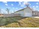 Side view of the property with an attached garage, driveway, and a backyard at 2243 E Werges Ave, Indianapolis, IN 46237