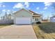 Charming single-Gathering home with an attached garage, driveway, and well-maintained lawn at 2243 E Werges Ave, Indianapolis, IN 46237
