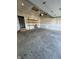 Spacious garage with shelves and a side door, offering ample storage and convenient access at 2243 E Werges Ave, Indianapolis, IN 46237