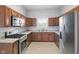 Well-equipped kitchen features stainless steel appliances, granite countertops, and stylish backsplash at 2243 E Werges Ave, Indianapolis, IN 46237