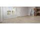 This open floor plan living room features new floors and a doorway leading to the kitchen at 2243 E Werges Ave, Indianapolis, IN 46237