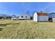 Spacious backyard featuring a shed, a white privacy fence, and a deck for outdoor entertaining at 2521 Beechcrest Dr, Indianapolis, IN 46203