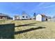 Spacious backyard featuring a shed, a wood privacy fence, and a deck for outdoor entertaining at 2521 Beechcrest Dr, Indianapolis, IN 46203