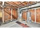 Unfinished basement featuring HVAC, water heater, stairs, and carpeting remnant at 2521 Beechcrest Dr, Indianapolis, IN 46203