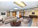 Staged basement with seating, dining and small kitchenette at 2521 Beechcrest Dr, Indianapolis, IN 46203