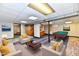 Finished basement featuring a pool table, neutral furniture, and an open floor plan at 2521 Beechcrest Dr, Indianapolis, IN 46203