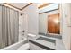 Cozy bathroom featuring a shower-tub combo, modern vanity, and neutral color scheme at 2521 Beechcrest Dr, Indianapolis, IN 46203