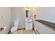Cozy bathroom with traditional vanity, mirror, and commode at 2521 Beechcrest Dr, Indianapolis, IN 46203