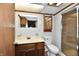 Cozy bathroom features a vanity with a sink, toilet, medicine cabinet and a shower with glass doors at 2521 Beechcrest Dr, Indianapolis, IN 46203
