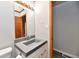 Bright bathroom featuring a gray vanity, modern faucet, and neutral walls at 2521 Beechcrest Dr, Indianapolis, IN 46203