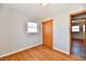 Bedroom features hardwood floors, baseboards, a window, and a closet at 2521 Beechcrest Dr, Indianapolis, IN 46203