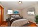 Serene bedroom with hardwood floors, ample natural light, and stylish decor at 2521 Beechcrest Dr, Indianapolis, IN 46203