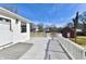 A white deck overlooks the backyard and features a white railing and a view of the neighborhood at 2521 Beechcrest Dr, Indianapolis, IN 46203