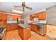 Traditional kitchen with stainless steel appliances, wood cabinets, and a center island at 2521 Beechcrest Dr, Indianapolis, IN 46203