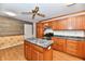 Traditional kitchen with a center island, wood cabinets, stone counter tops, and stainless steel appliances at 2521 Beechcrest Dr, Indianapolis, IN 46203