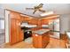 Traditional kitchen featuring wood cabinets, stainless steel appliances, and a center island with granite countertops at 2521 Beechcrest Dr, Indianapolis, IN 46203