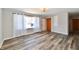 Sun-filled living room features new floors, a window, light fixture and front door at 2521 Beechcrest Dr, Indianapolis, IN 46203