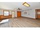 Bright living room with light wood floors, neutral walls, recessed lighting, and natural light at 2521 Beechcrest Dr, Indianapolis, IN 46203
