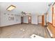 Spacious living room with light wood floors, neutral walls, ceiling fan, and recessed lighting at 2521 Beechcrest Dr, Indianapolis, IN 46203