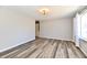 Open-concept living room with wood-look floors and ample natural light at 2521 Beechcrest Dr, Indianapolis, IN 46203