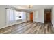 Sun-filled living room features new floors, a window, light fixture and front door at 2521 Beechcrest Dr, Indianapolis, IN 46203