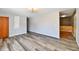 Empty living room featuring laminate flooring and neutral paint at 2521 Beechcrest Dr, Indianapolis, IN 46203