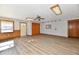 Open living room with light wood floors, neutral walls, recessed lighting, and natural light at 2521 Beechcrest Dr, Indianapolis, IN 46203
