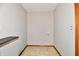 Utility room with neutral paint, flooring, and door to adjacent space at 2521 Beechcrest Dr, Indianapolis, IN 46203