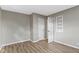 Inviting bedroom with wood-look floors and white trim, offering a bright and neutral space at 305 Bixler Rd, Indianapolis, IN 46227