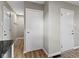 Hallway featuring modern wood floors and doors at 305 Bixler Rd, Indianapolis, IN 46227