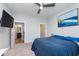 Large bedroom featuring neutral walls, carpeted floors, and a ceiling fan for added comfort at 319 E 16Th St # 203, Indianapolis, IN 46202