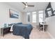Bright bedroom with a large bed, a ceiling fan, and natural light from multiple windows at 319 E 16Th St # 203, Indianapolis, IN 46202