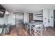 Community room with elevator access, a kitchenette, dining space, and city views at 319 E 16Th St # 203, Indianapolis, IN 46202