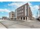 Street view showcasing the building's architecture and surrounding neighborhood at 319 E 16Th St # 203, Indianapolis, IN 46202
