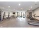 Spacious gym featuring modern equipment, rubber flooring, and bright windows at 319 E 16Th St # 203, Indianapolis, IN 46202
