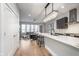 Open-concept kitchen with stainless steel appliances and hardwood floors at 319 E 16Th St # 203, Indianapolis, IN 46202