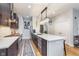 Modern kitchen featuring stainless steel appliances and an elegant central island with a white countertop at 319 E 16Th St # 203, Indianapolis, IN 46202
