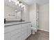 Bright bathroom with double sink vanity, gray countertop, and wood-look flooring at 4150 Douro Trl, Westfield, IN 46062