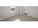 Sunlit bedroom with a view to the front yard, plush carpet, and ensuite access at 4150 Douro Trl, Westfield, IN 46062