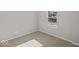 Cozy bedroom with plush carpeting and a bright window overlooking the outdoors at 4150 Douro Trl, Westfield, IN 46062