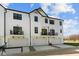 Stylish townhomes with individual garages, private balconies, and modern white siding at 4150 Douro Trl, Westfield, IN 46062