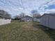 Spacious backyard featuring a shed and partial fence at 428 Cleveland St, Columbus, IN 47201