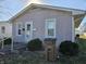 Charming single story home with vinyl siding, an inviting front entrance and manicured landscaping at 428 Cleveland St, Columbus, IN 47201