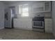 Well-lit kitchen with white cabinets, stainless steel appliances, and updated backsplash at 428 Cleveland St, Columbus, IN 47201