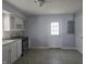 Bright kitchen featuring white cabinets, stainless steel range and door leading outside at 428 Cleveland St, Columbus, IN 47201