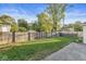 View of the grassy backyard enclosed by a wooden fence, offering privacy and a safe space for outdoor activities at 4305 Central Ave, Indianapolis, IN 46205