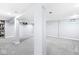 Expansive finished basement with neutral carpeting and supporting beams at 4305 Central Ave, Indianapolis, IN 46205