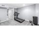 Finished basement with exercise equipment, including a treadmill and punching bag at 4305 Central Ave, Indianapolis, IN 46205